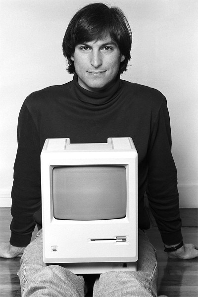 Steve Jobs with a Macintosh