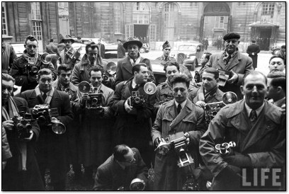Press Photographers crowd around Dwight D. Eisenhower, 1951