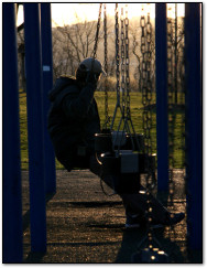 Mark Bussler on a Swing Set