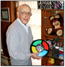 Ralph Baer holds a Simon toy in his basement, May 2012