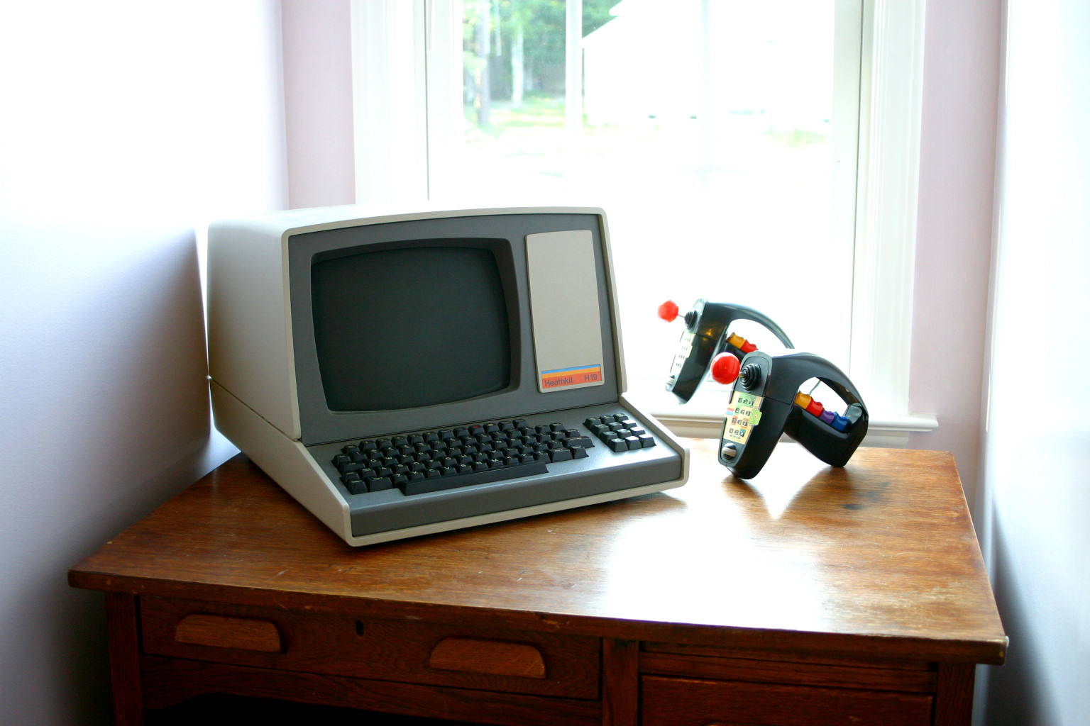 The Vintage Computing and Gaming Logo H-19 terminal and Coleco Super Action Controllers